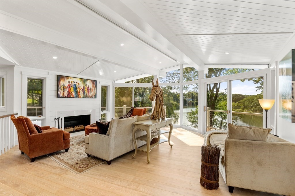78 Nichols Road Cohasset, MA 02025 - Photo 2 of 23 a living room with fireplace furniture and a large window