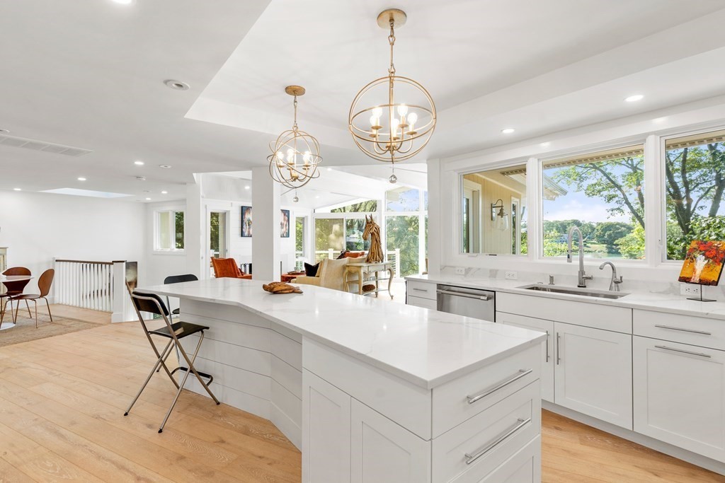 78 Nichols Road Cohasset, MA 02025 - Photo 5 of 23 a kitchen with stainless steel appliances a stove a table a sink and cabinets