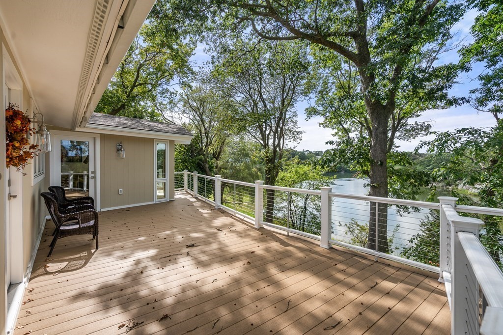 78 Nichols Road Cohasset, MA 02025 - Photo 7 of 23 a view of a backyard with wooden fence and large trees