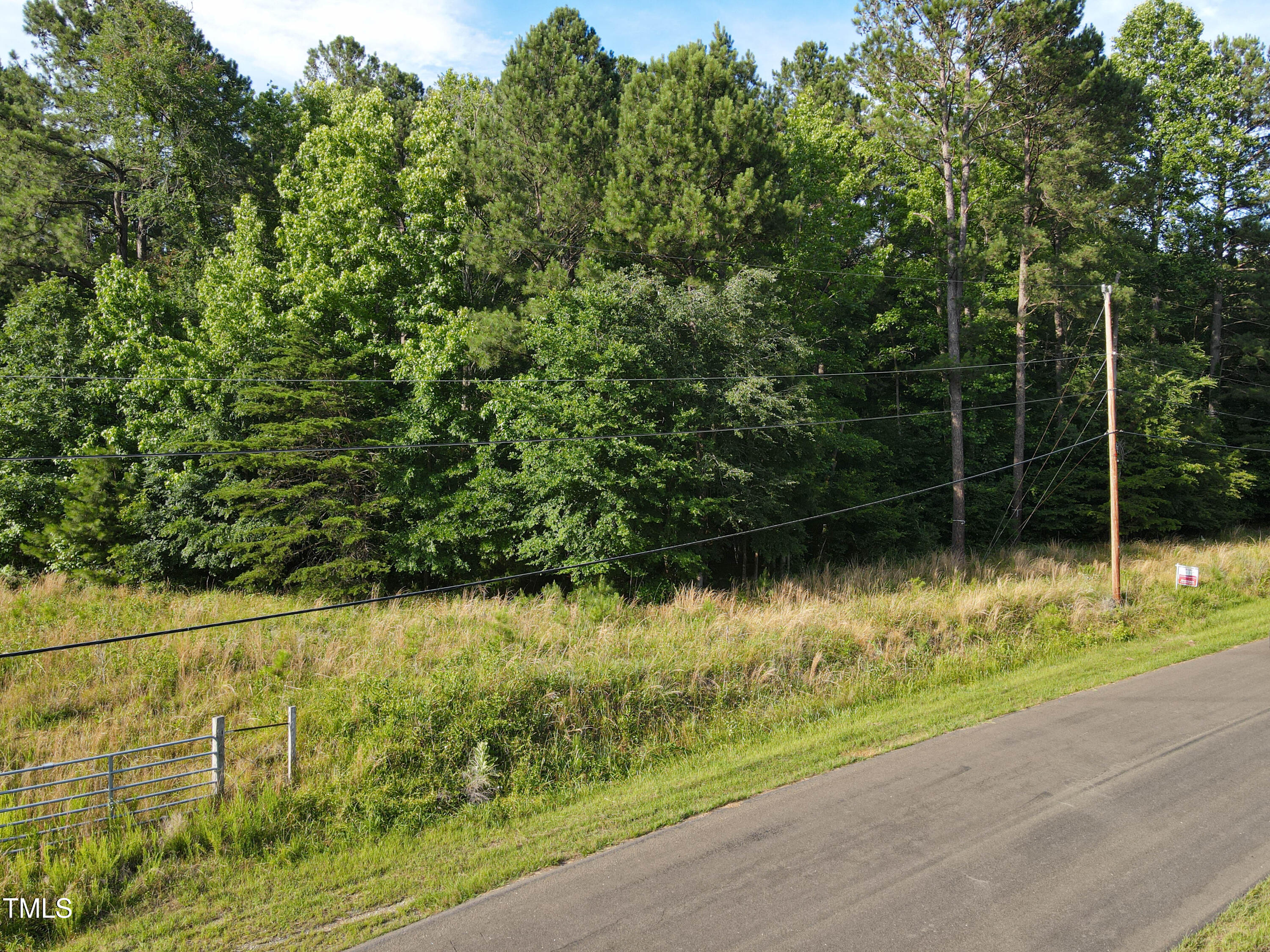 1617 Torredge Road Durham, NC 27712 - Photo 5 of 8 a view of a lake with a house and a yard with wooden floor