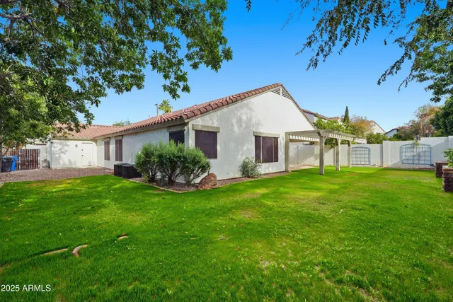 a view of a house with a back yard