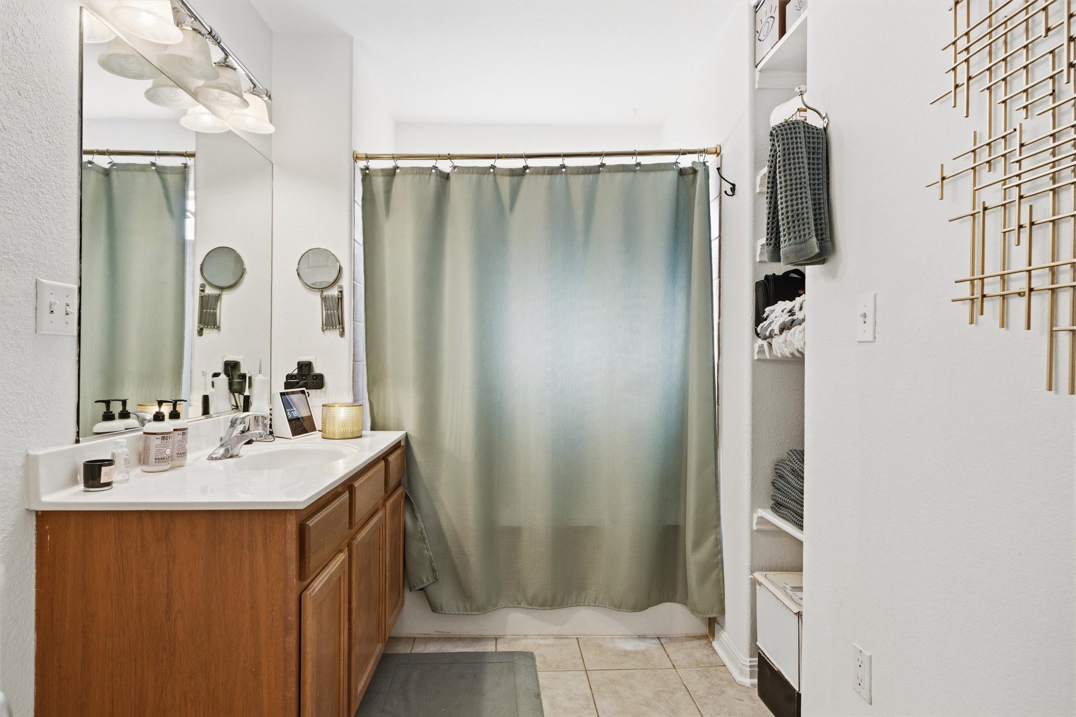 3015 Castro Street Austin, TX 78702 - Photo 27 of 40 Functional bathroom featuring a single vanity and a shower with an enclosed curtain.