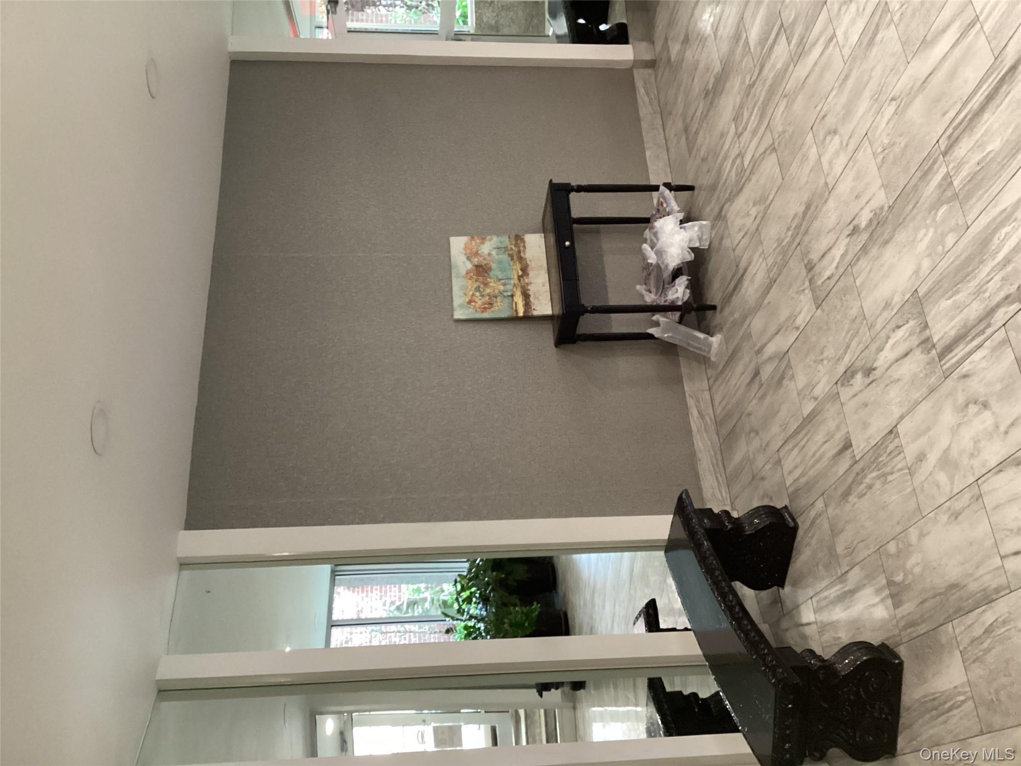 3176 Decatur Avenue, Unit 4F Bronx, NY 10467 - Photo 13 of 13 a living room with a bed and a window