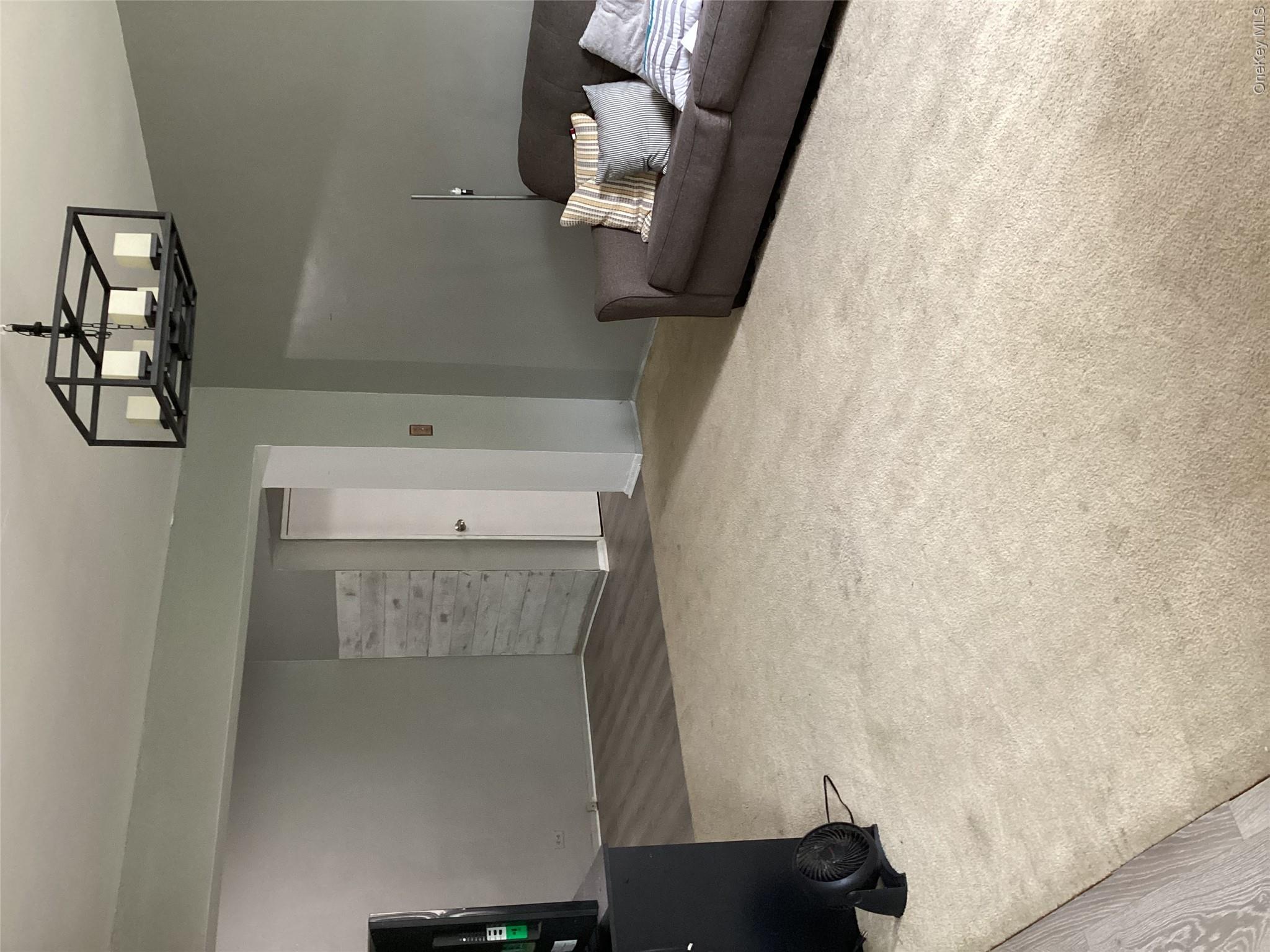 3176 Decatur Avenue, Unit 4F Bronx, NY 10467 - Photo 9 of 23 a bedroom with a bed and cabinets