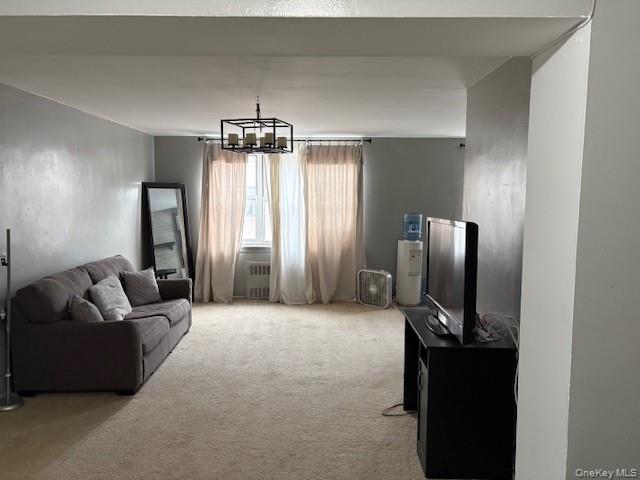 3176 Decatur Avenue, Unit 4F Bronx, NY 10467 - Photo 10 of 23 a living room with furniture and a flat screen tv
