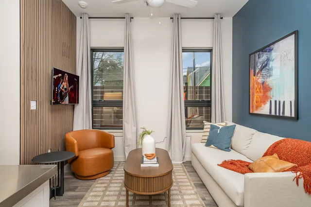 a living room with furniture and a large window