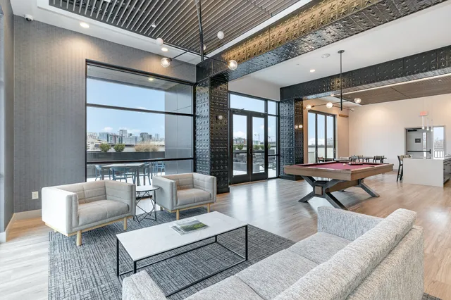 a living room with furniture and a table