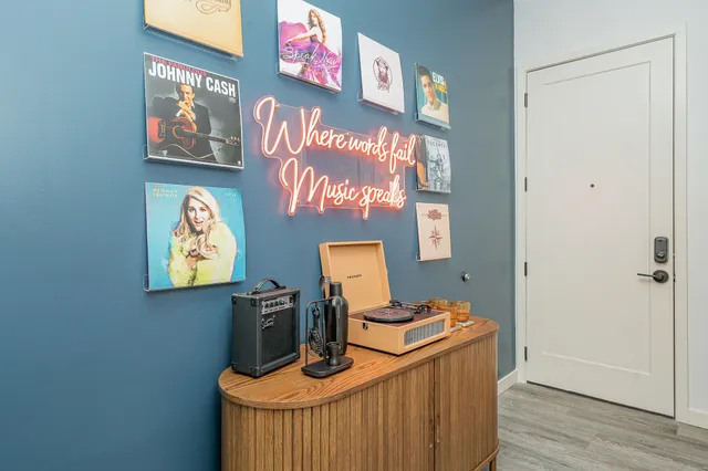 a view of a workspace with furniture and wooden floor
