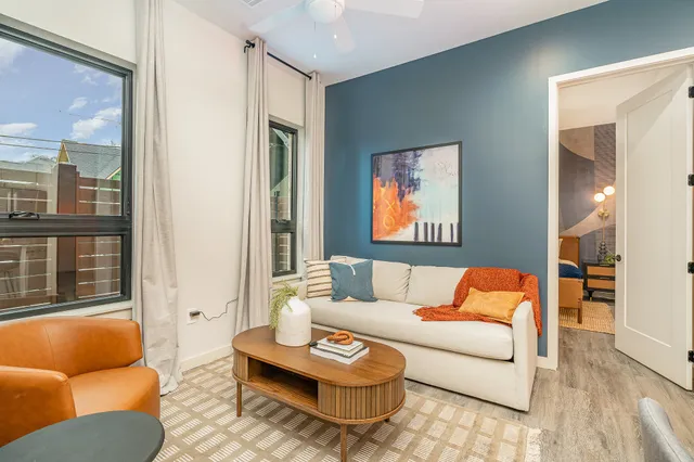 a living room with furniture and a rug