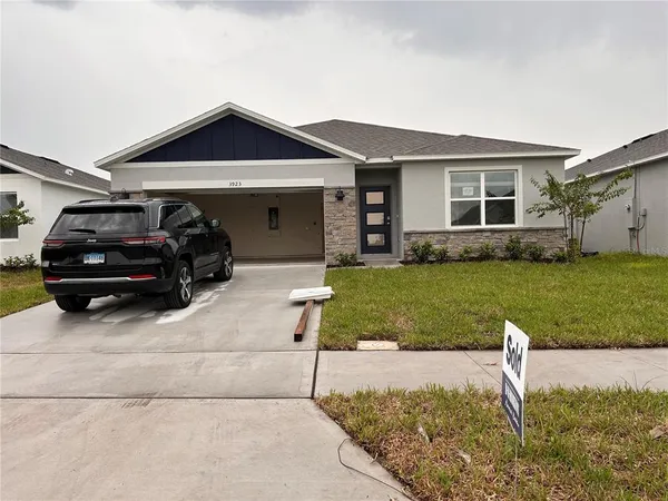a car parked in front of a house