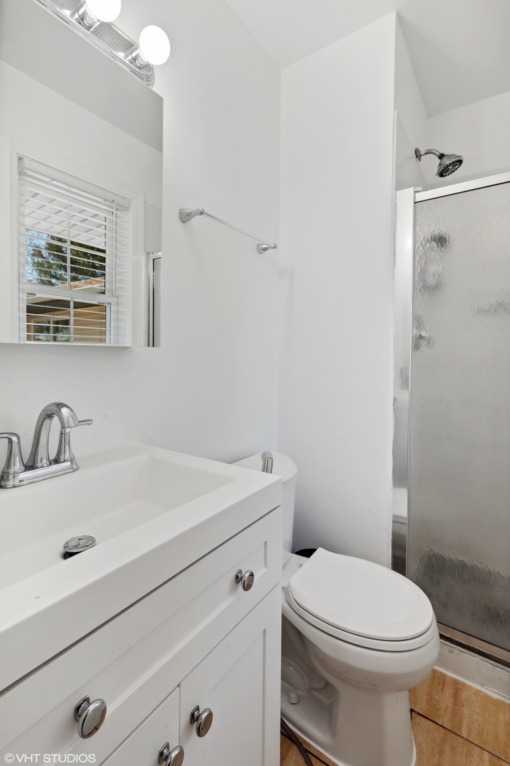 269 Seabury Road Bolingbrook, IL 60440 - Photo 14 of 21 a bathroom with a sink a toilet and shower