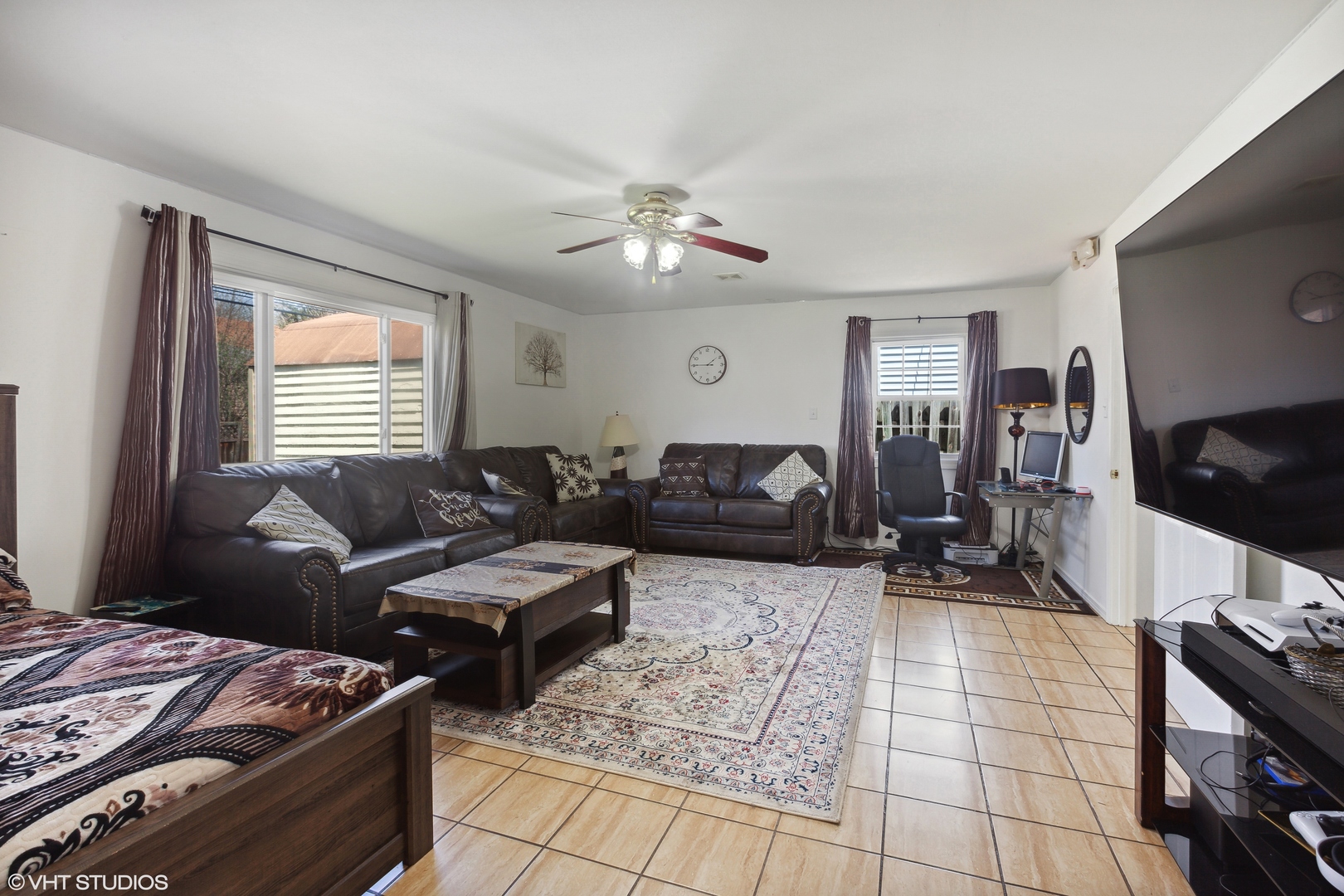 269 Seabury Road Bolingbrook, IL 60440 - Photo 16 of 21 a living room with furniture and a flat screen tv