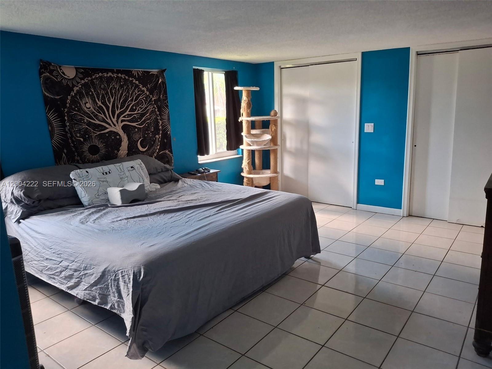 540 Southwest 39th Avenue Miami, FL 33134 - Photo 16 of 48 a bedroom with a bed and a walk in closet