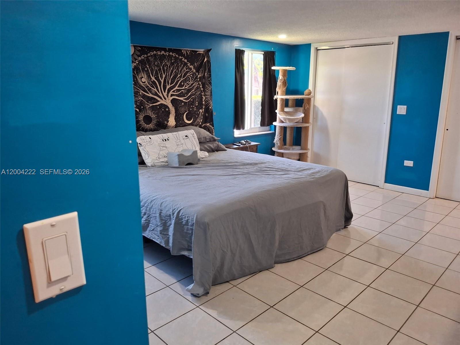 540 Southwest 39th Avenue Miami, FL 33134 - Photo 18 of 48 a bedroom with a large bed and a large mirror