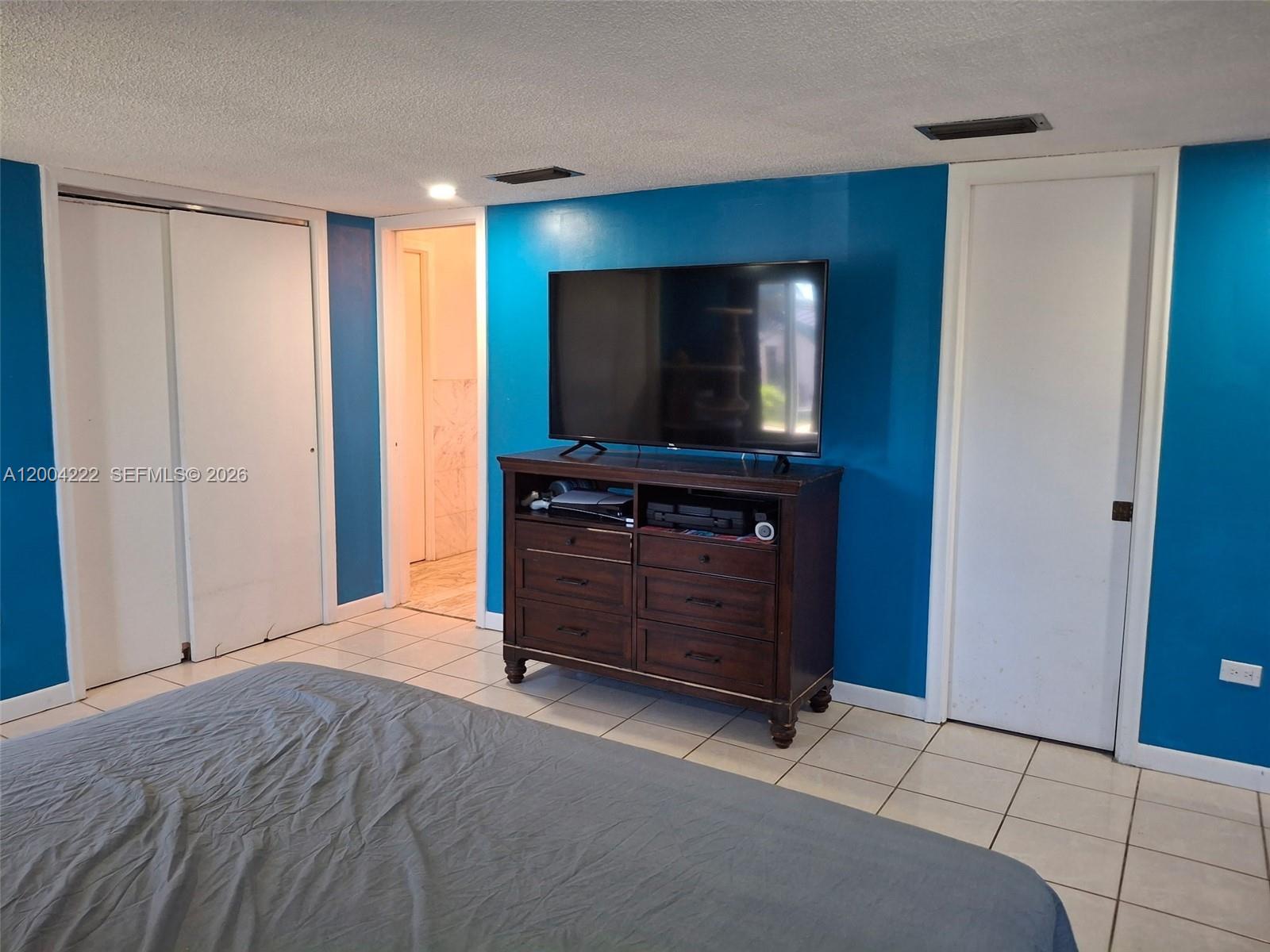 540 Southwest 39th Avenue Miami, FL 33134 - Photo 19 of 48 a living room with furniture and a flat screen tv