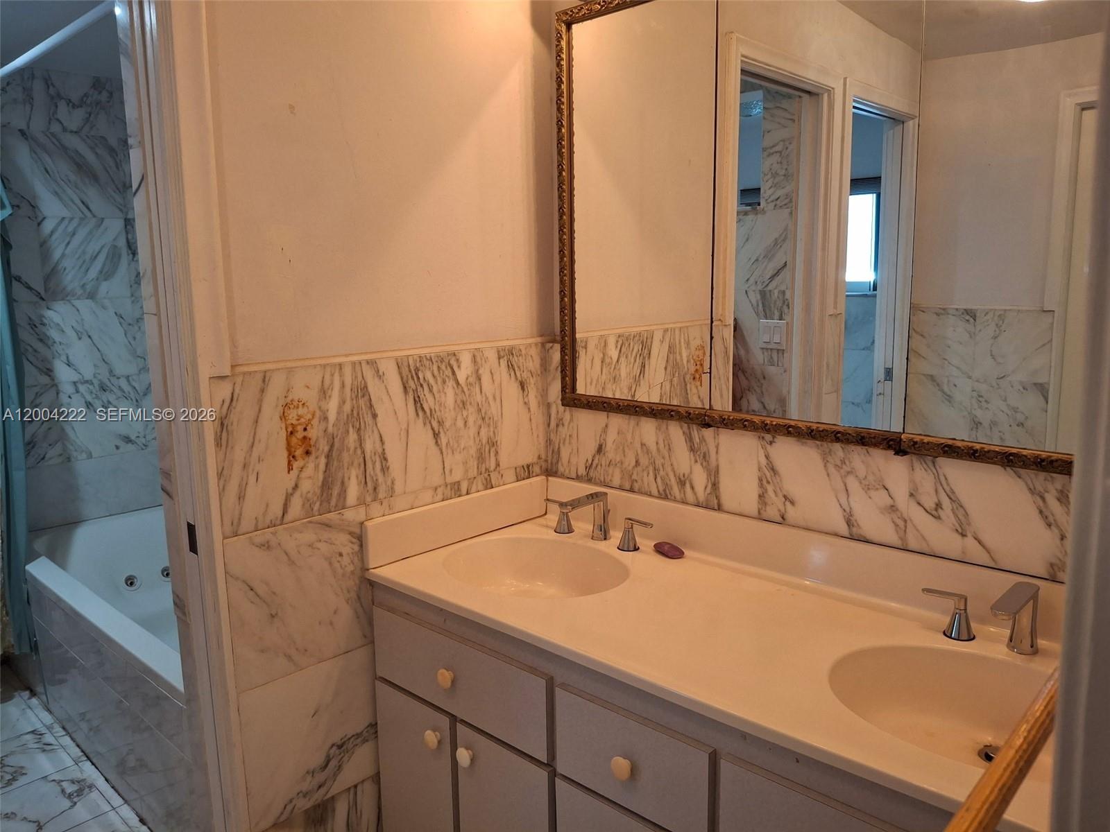 540 Southwest 39th Avenue Miami, FL 33134 - Photo 22 of 48 a bathroom with a sink and a mirror