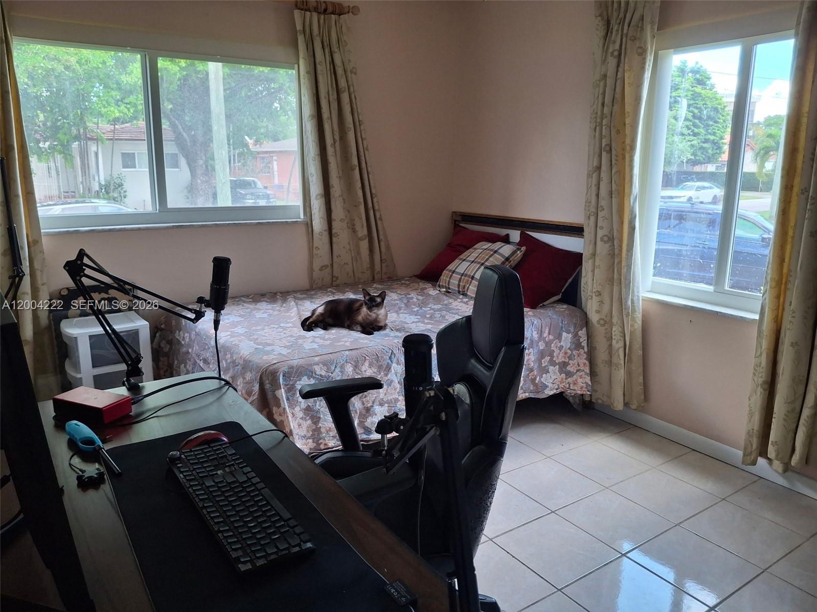 540 Southwest 39th Avenue Miami, FL 33134 - Photo 27 of 48 a bed sitting in a bedroom next to a window
