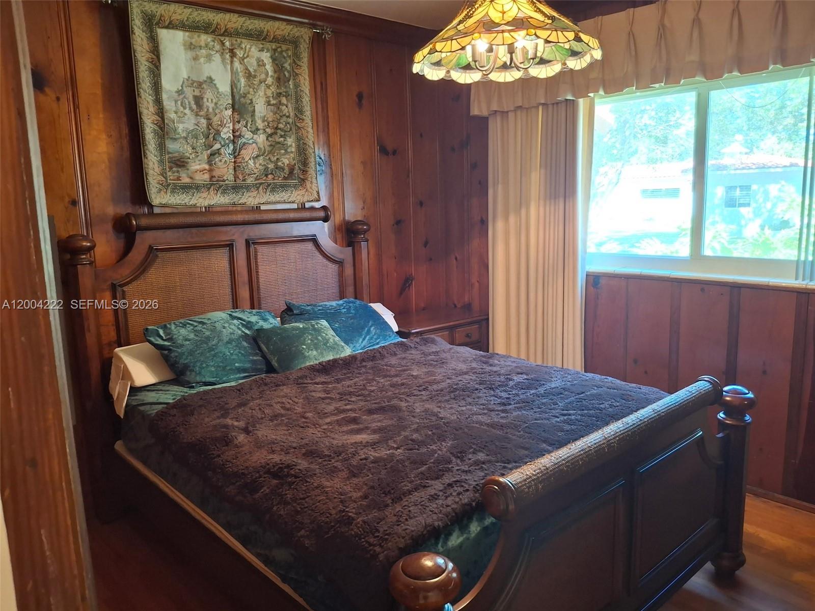 540 Southwest 39th Avenue Miami, FL 33134 - Photo 34 of 48 a bed sitting in a bedroom next to a window