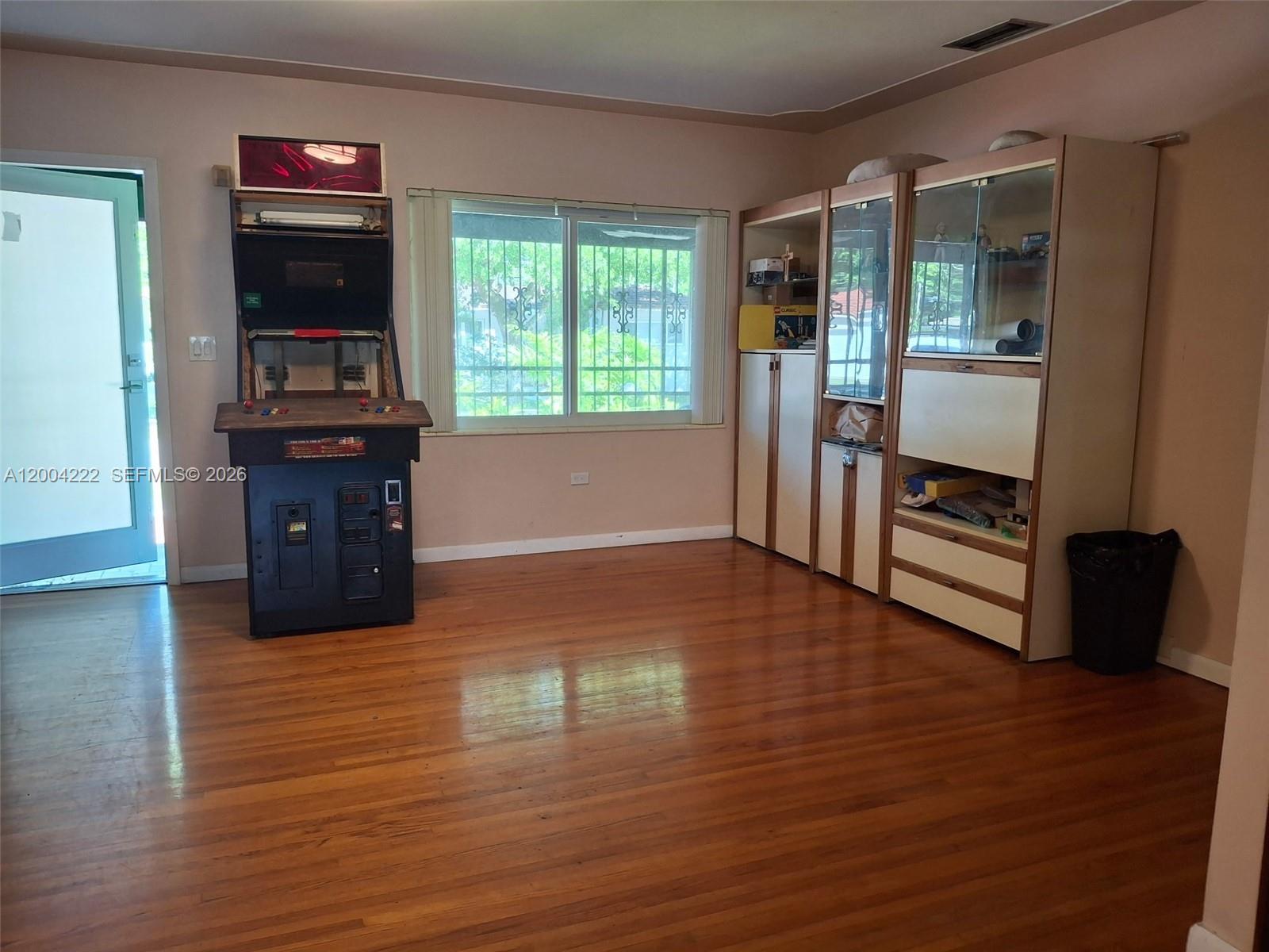 540 Southwest 39th Avenue Miami, FL 33134 - Photo 4 of 48 a living room with furniture and a flat screen tv