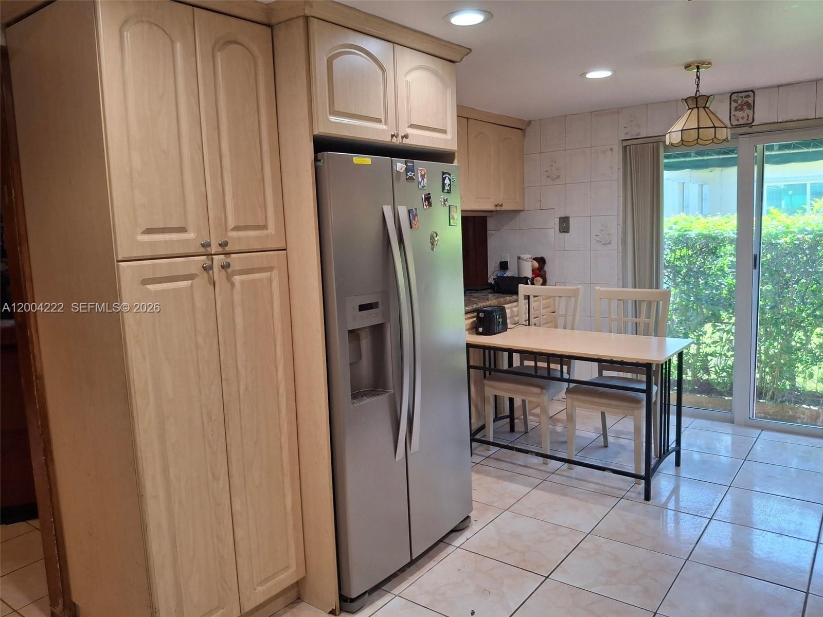540 Southwest 39th Avenue Miami, FL 33134 - Photo 43 of 48 a kitchen with stainless steel appliances granite countertop a refrigerator a stove and a sink