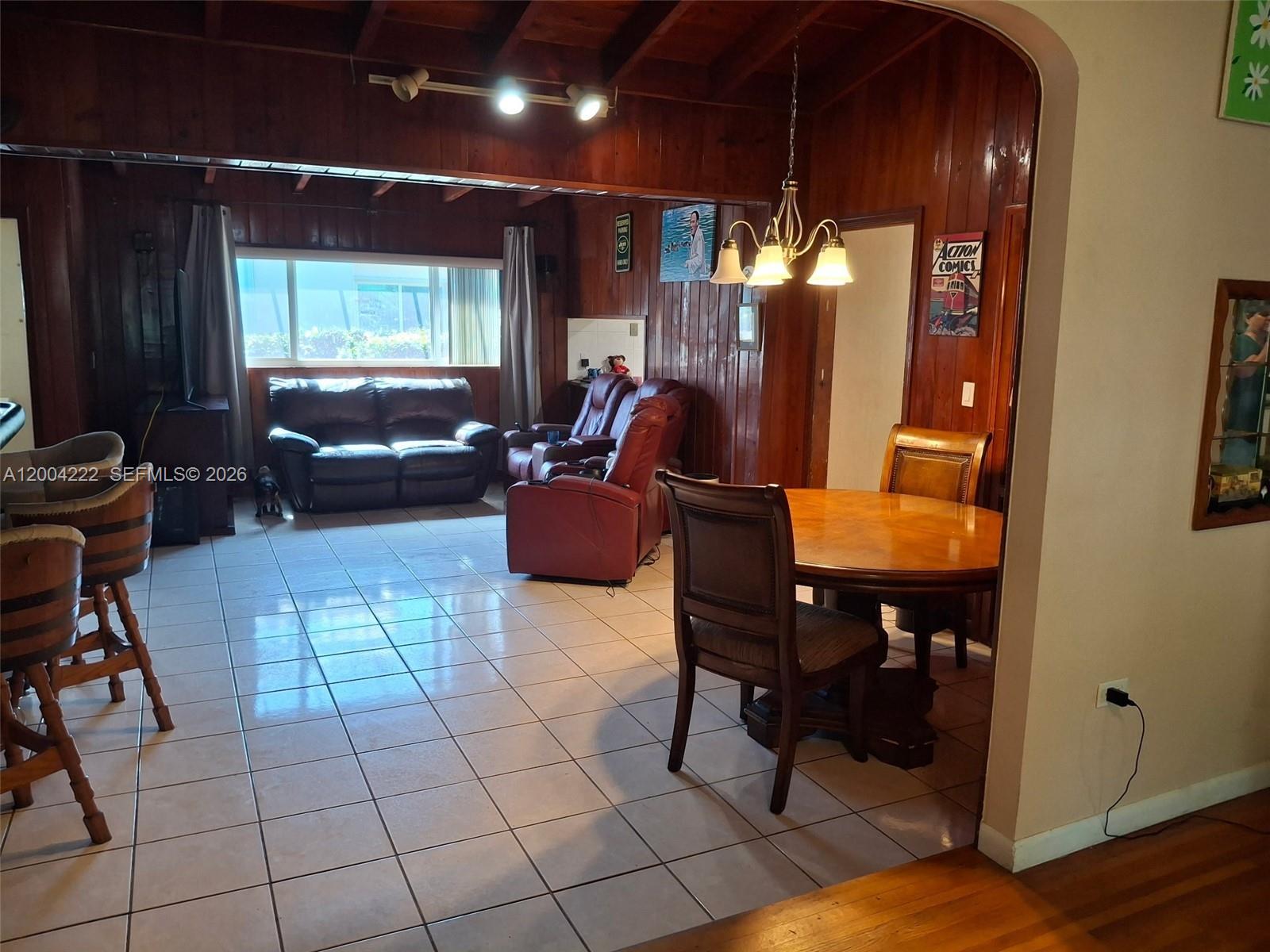 540 Southwest 39th Avenue Miami, FL 33134 - Photo 7 of 48 a living room with furniture a flat screen tv and a window
