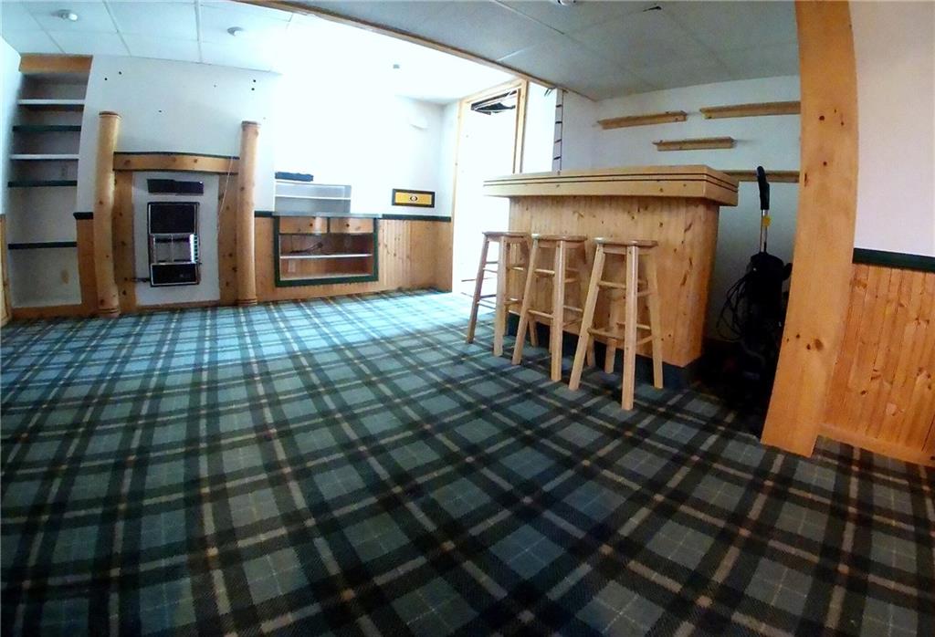 5365 Library Road Bethel Park, PA 15102 - Photo 19 of 25 19x11 Lower level family room is trimmed with knotty pine. Bar and bar stools are included!