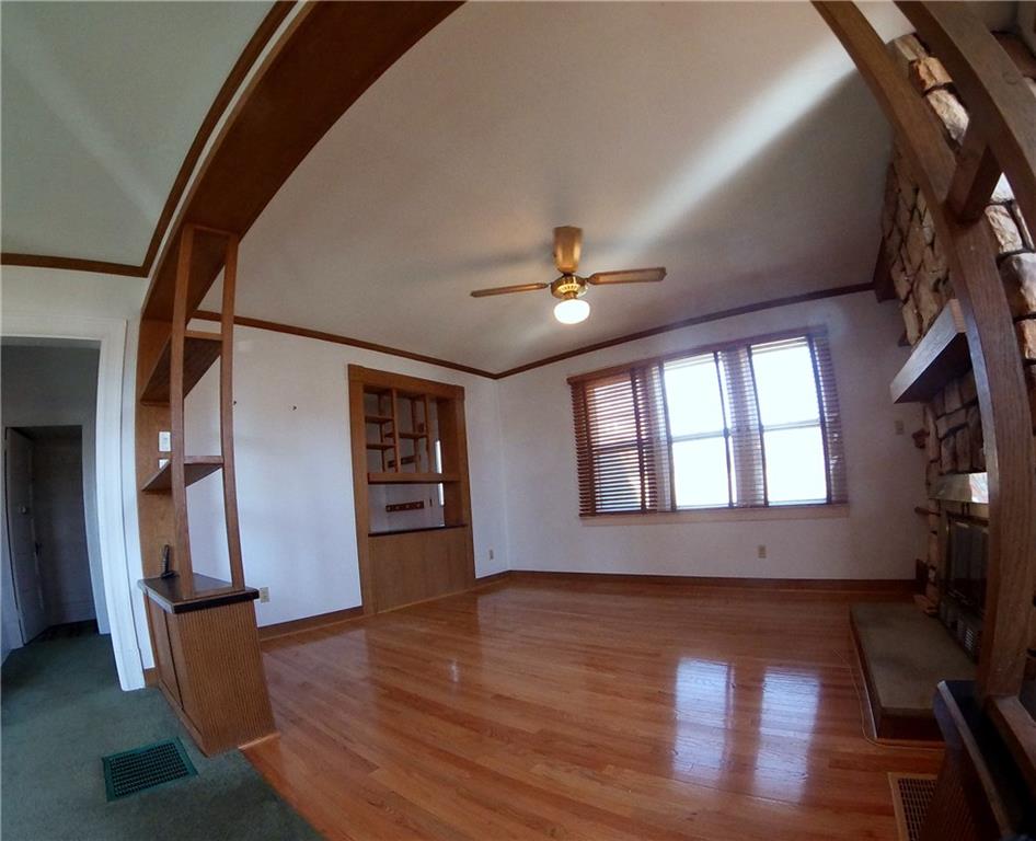 5365 Library Road Bethel Park, PA 15102 - Photo 4 of 25 15x14 Living Room with crown moldings to match the open shelving and trim. Triple window lets the sun pour in!