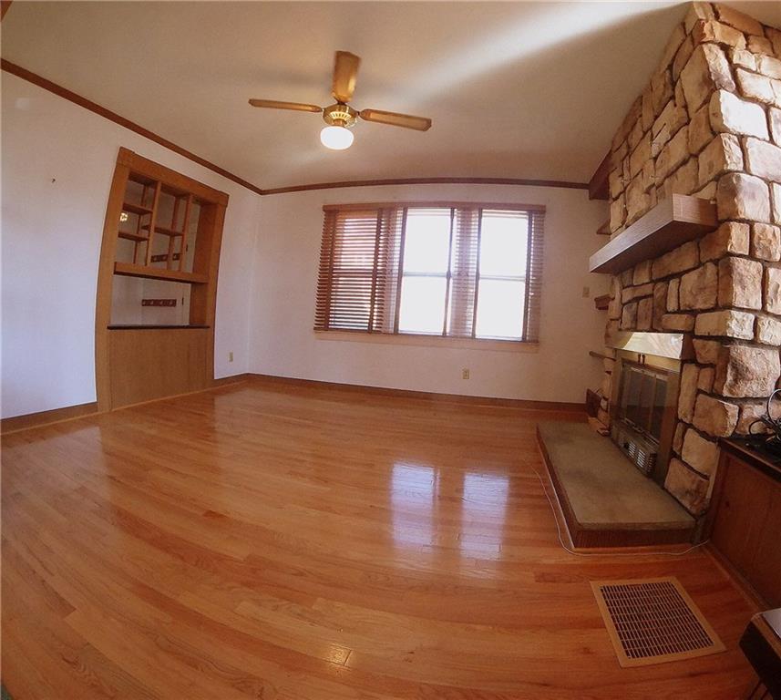 5365 Library Road Bethel Park, PA 15102 - Photo 5 of 25 Stone fireplace is the centerpiece of the living room.
