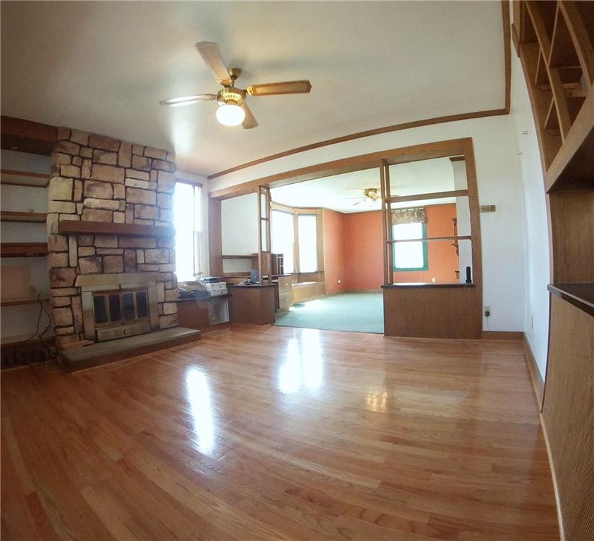 5365 Library Road Bethel Park, PA 15102 - Photo 6 of 25 Living room flows into the dining room. Both boast wood crown moldings and open shelving.