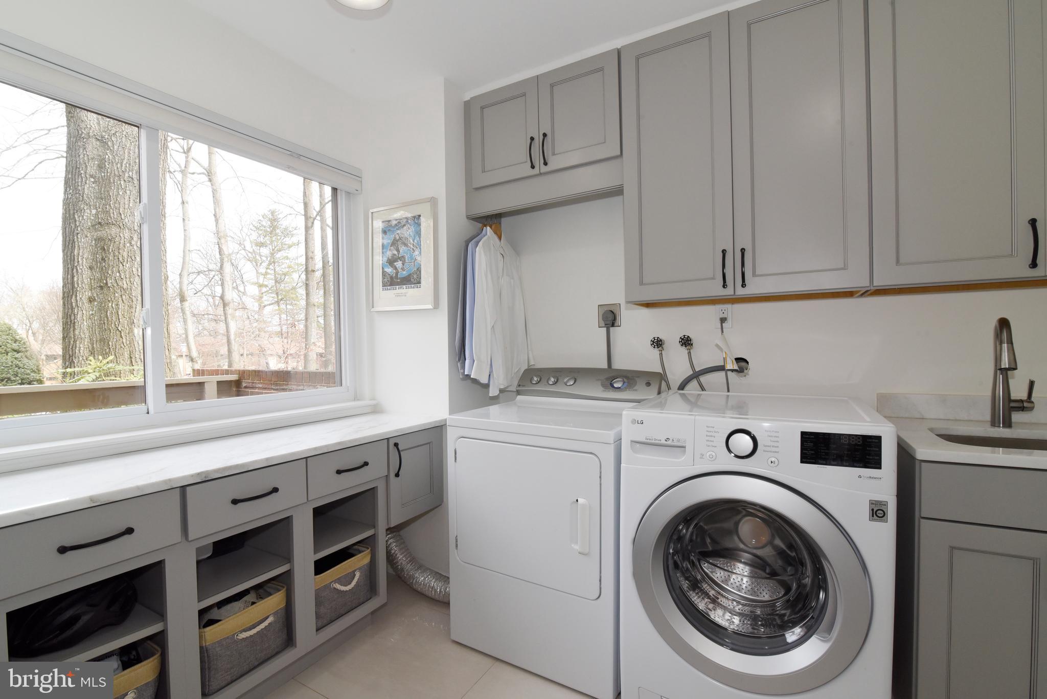11749 Indian Ridge Road Reston, VA 20191 - Photo 20 of 53 a kitchen with stainless steel appliances white cabinets and a window