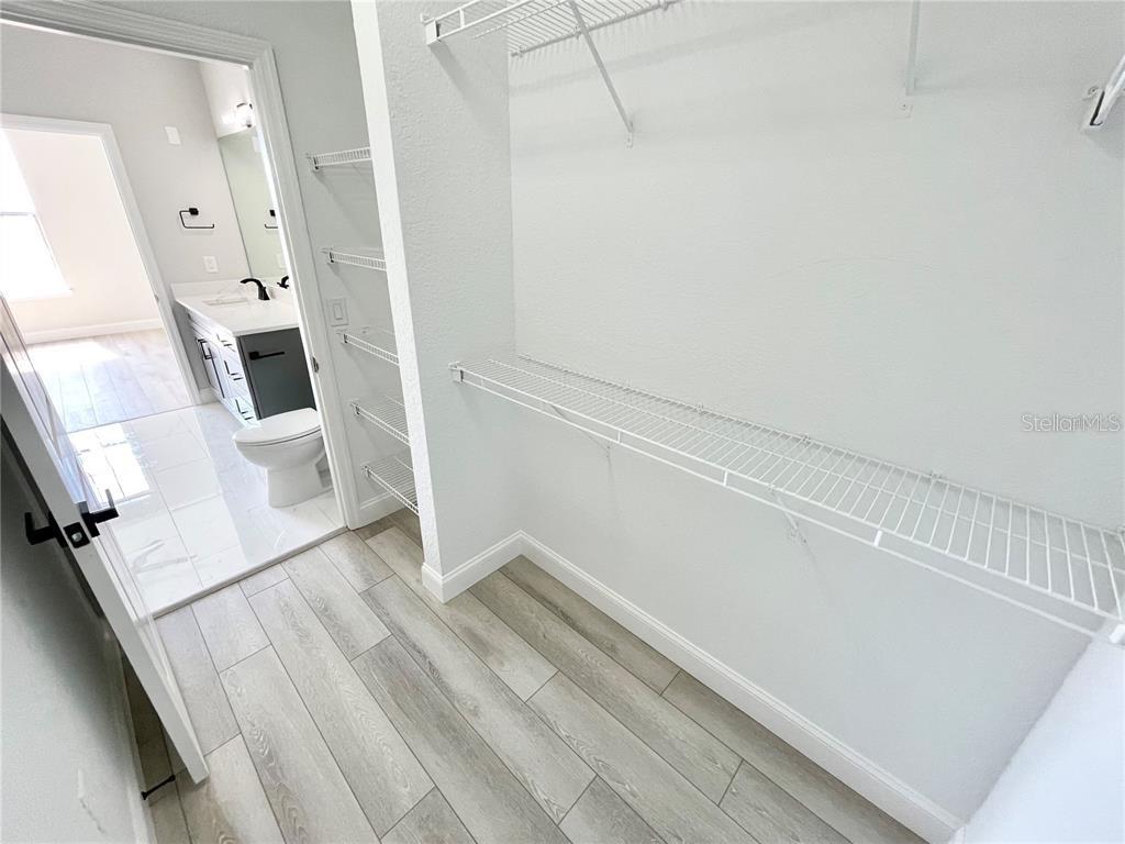 4221 West Spruce Street, Unit 2401 Tampa, FL 33607 - Photo 12 of 22 a view of a hallway with wooden floor and staircase
