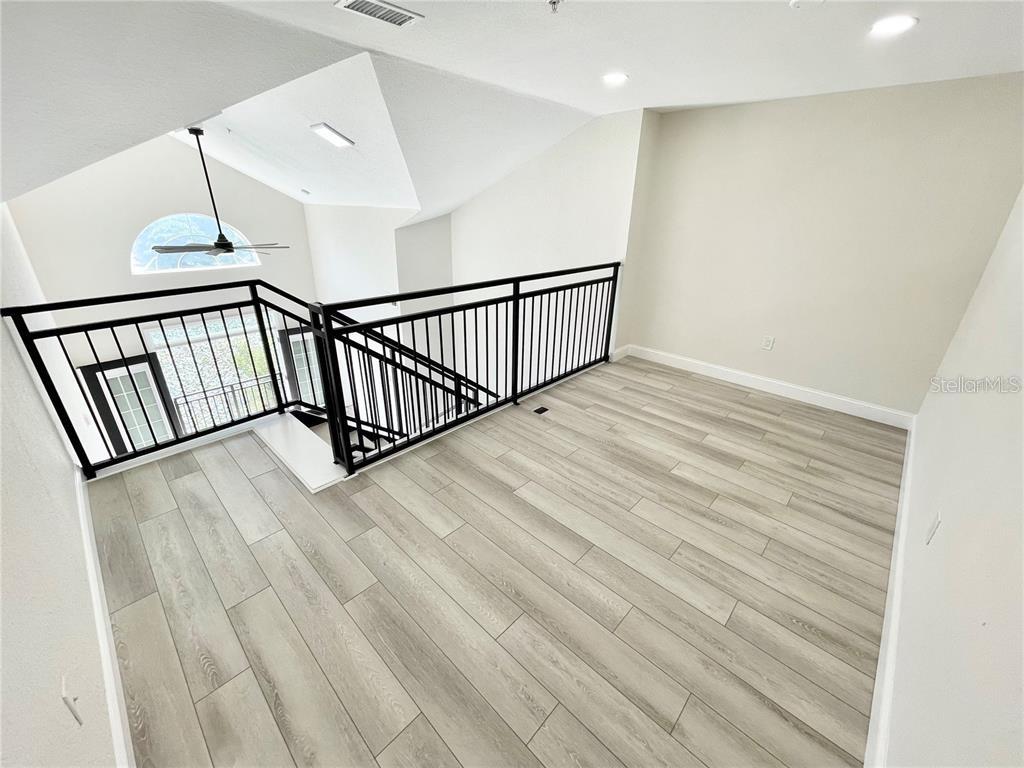 4221 West Spruce Street, Unit 2401 Tampa, FL 33607 - Photo 15 of 22 a view of hallway with wooden floor