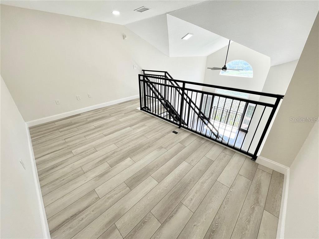 4221 West Spruce Street, Unit 2401 Tampa, FL 33607 - Photo 16 of 22 a view of a hallway with wooden floor