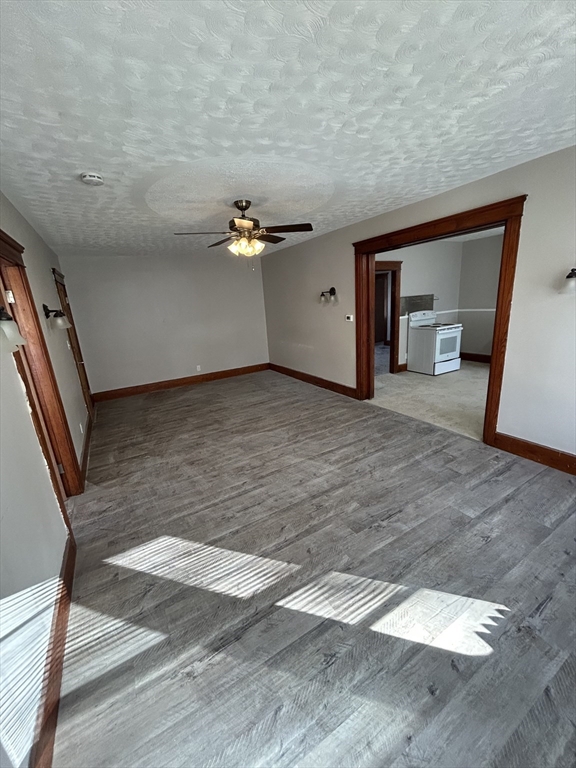 6 Boyden Street, Unit 1F Webster, MA 01570 - Photo 4 of 7 a view of a livingroom with a staircase