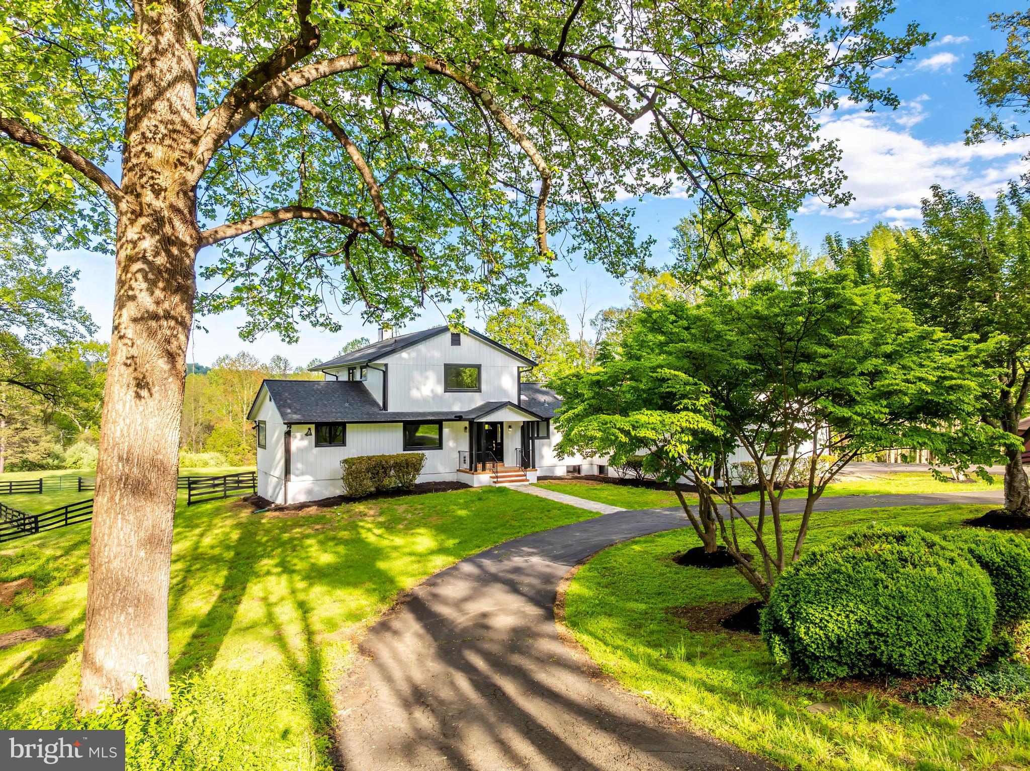 6891 Wilson Road Marshall, VA 20115 - Photo 2 of 118 Charming home amidst lush greenery.