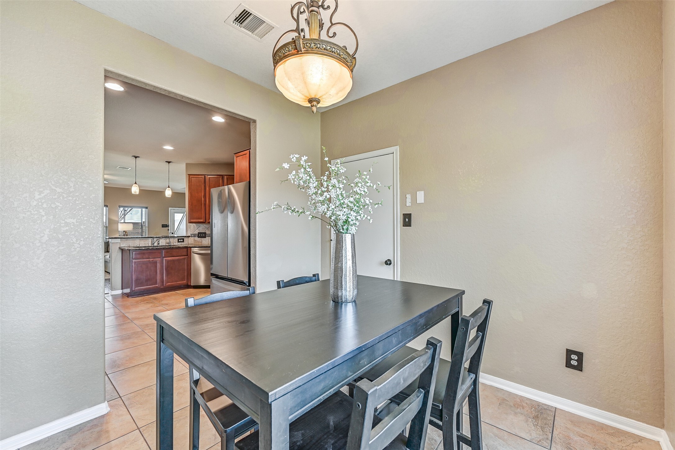 4206 Brightridge Court Rosenberg, TX 77471 - Photo 13 of 27 a kitchen with a table and chairs in it