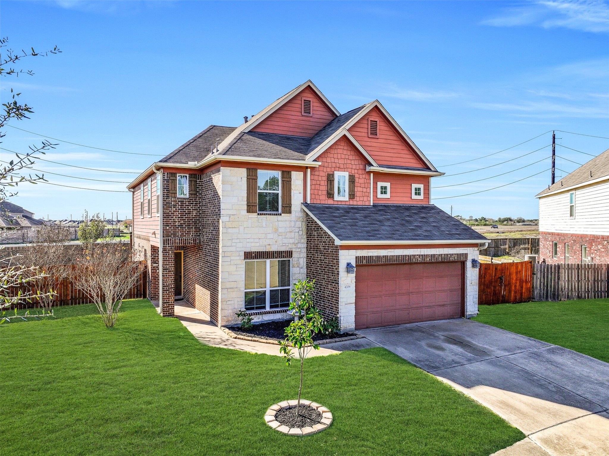 4206 Brightridge Court Rosenberg, TX 77471 - Photo 2 of 27 a front view of a house with a yard and garage