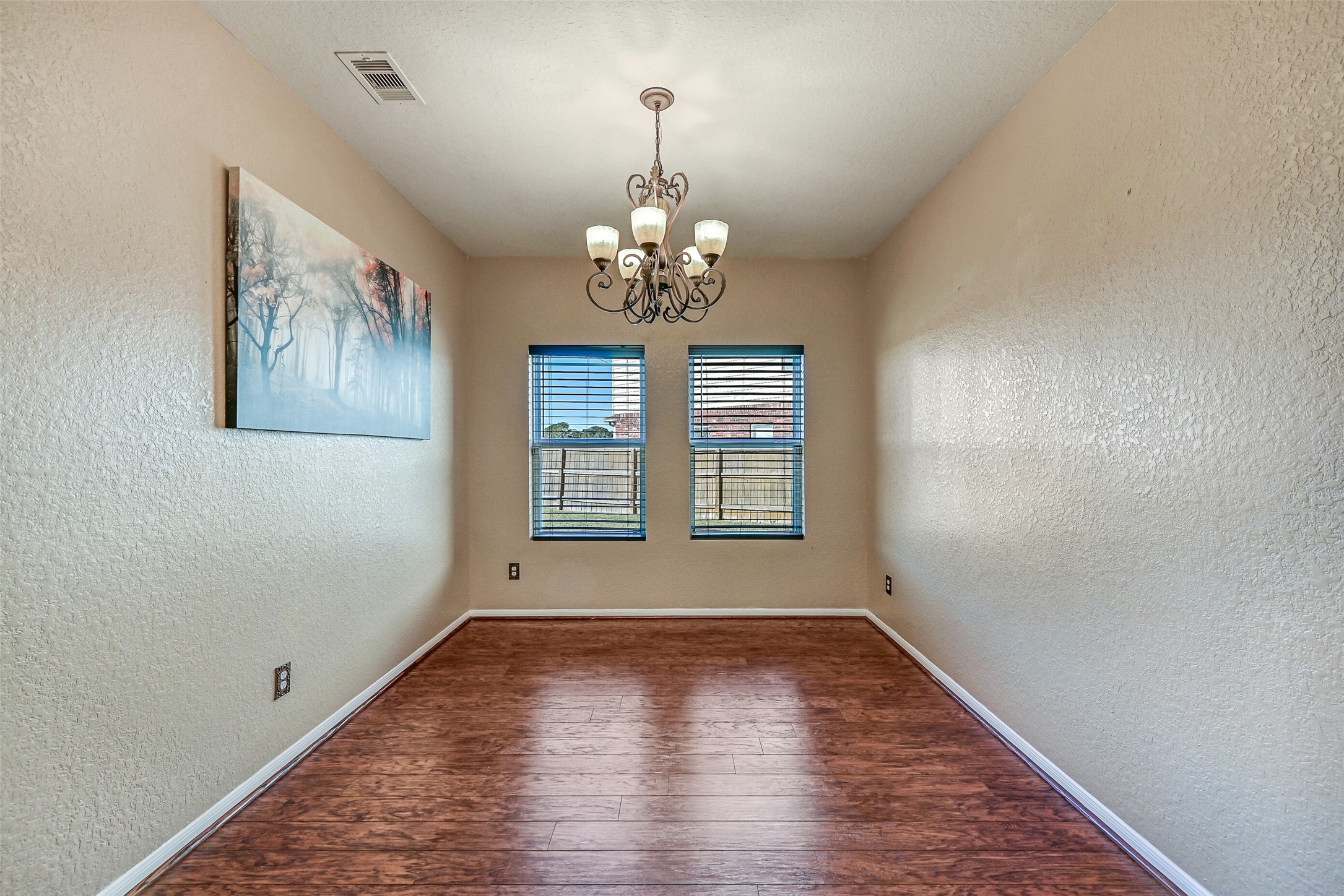 4206 Brightridge Court Rosenberg, TX 77471 - Photo 8 of 27 wooden floor in an empty room with a window