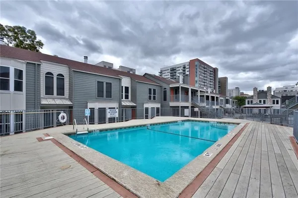 a view of a livingroom with a fireplace wooden floor and window