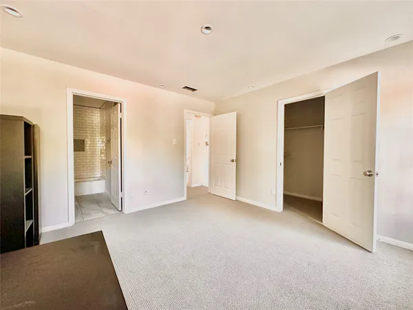 an empty room with closet area