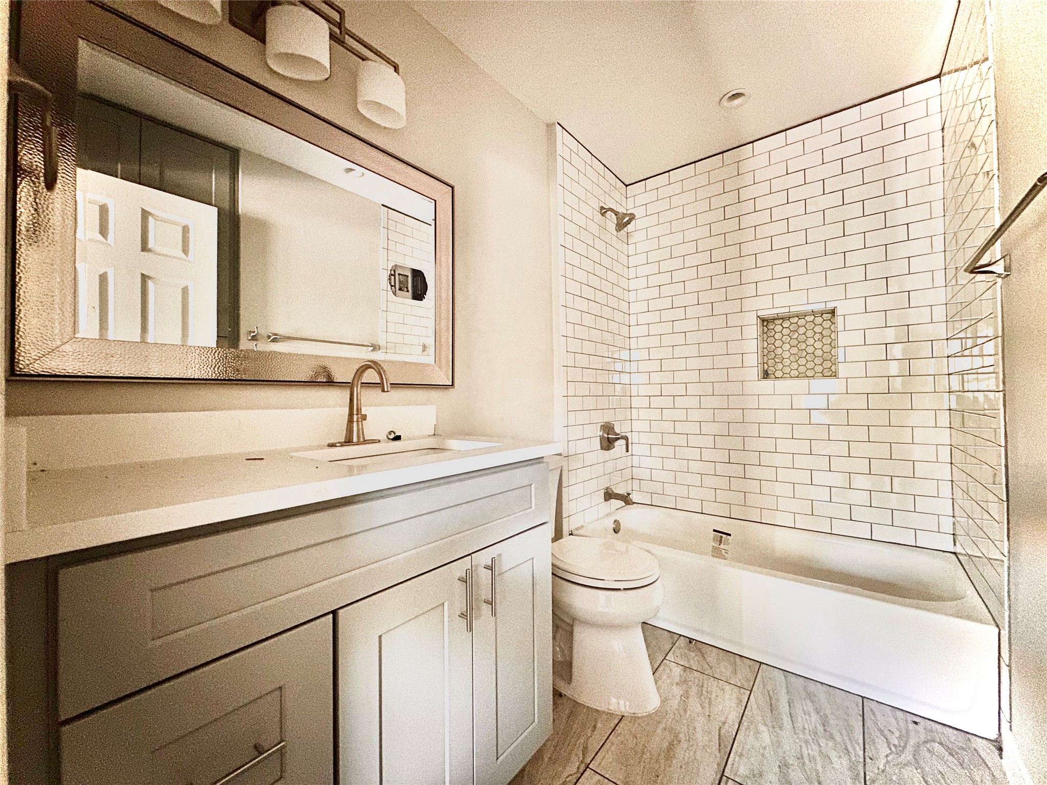 2529 Rio Grande Street, Unit 1 Austin, TX 78705 - Photo 8 of 9 a bathroom with a sink a toilet and a bathtub