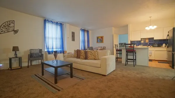 a living room with furniture and a table