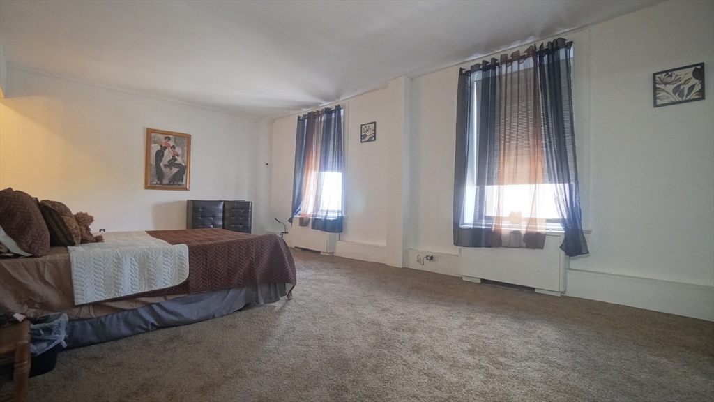 140 Chestnut Street, Unit 314 Springfield, MA 01103 - Photo 16 of 21 a living room with furniture and a window