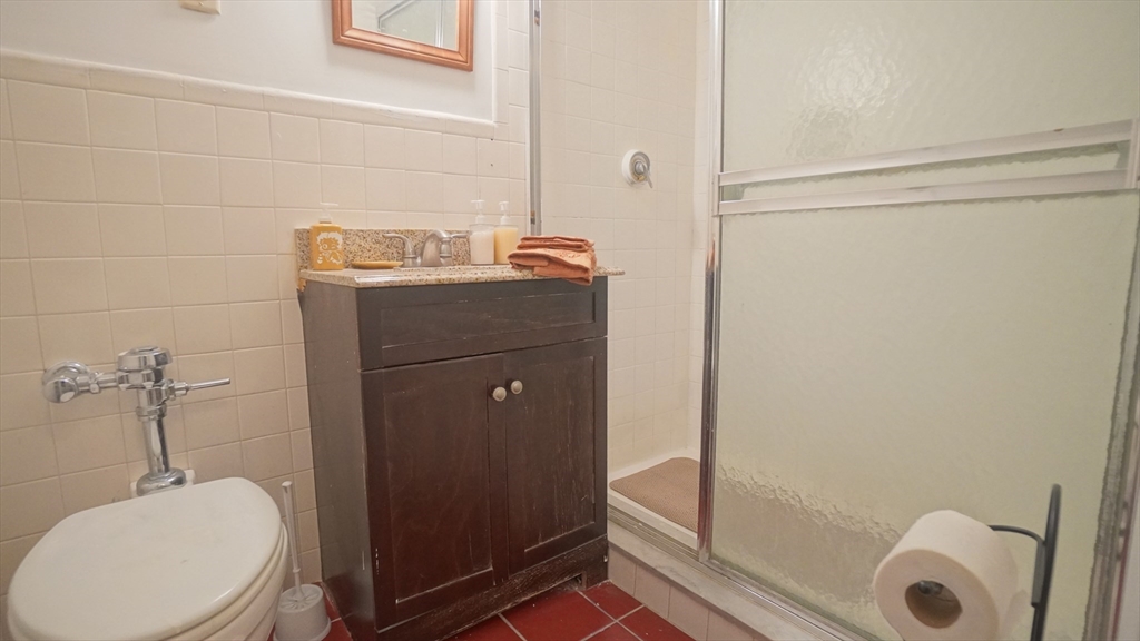 140 Chestnut Street, Unit 314 Springfield, MA 01103 - Photo 19 of 21 a bathroom with a sink and mirror