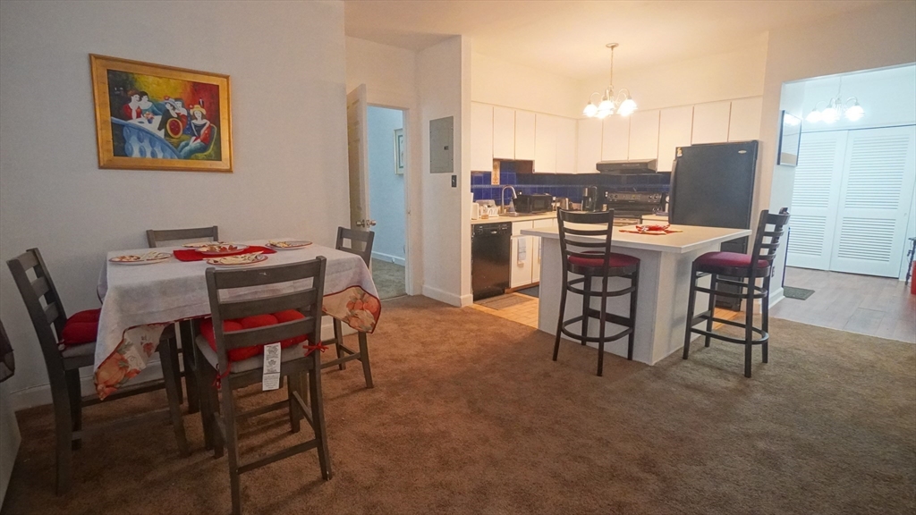 140 Chestnut Street, Unit 314 Springfield, MA 01103 - Photo 6 of 21 a dining room with furniture and a kitchen