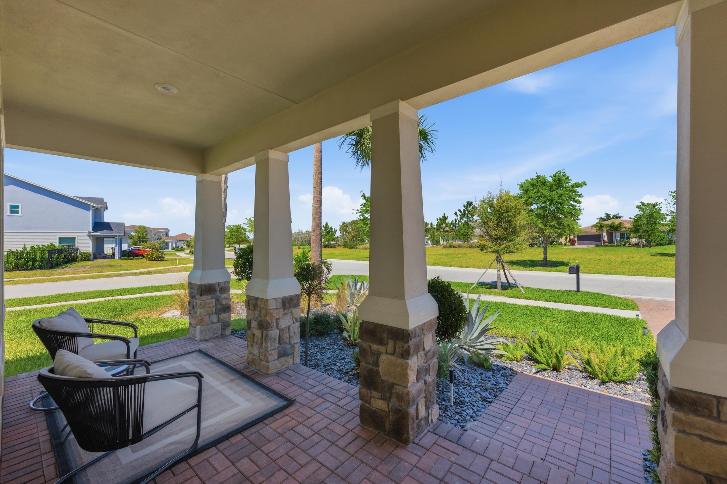 19230 Rolling Acres Road Loxahatchee, FL 33470 - Photo 40 of 58 a swimming pool with outdoor seating and yard
