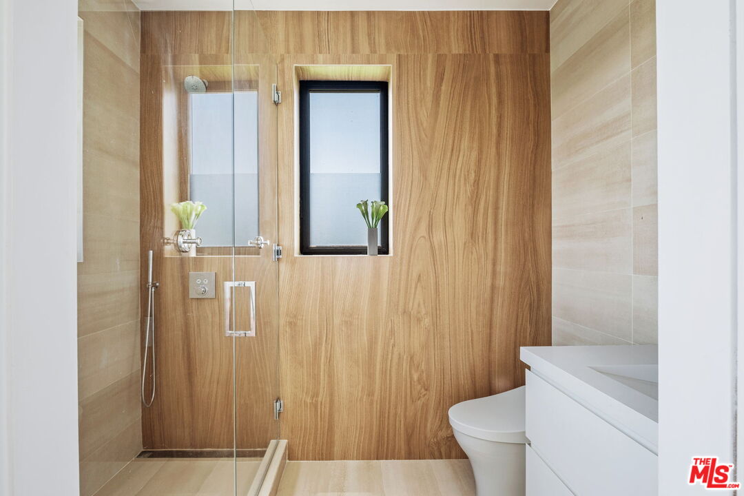 2200 Stradella Road Los Angeles, CA 90077 - Photo 15 of 27 a bathroom with a toilet and a shower