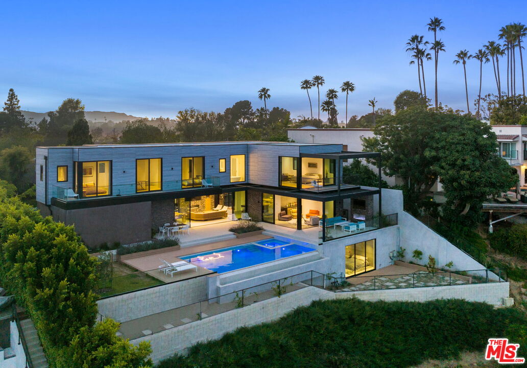 2200 Stradella Road Los Angeles, CA 90077 - Photo 24 of 27 a swimming pool with outdoor seating and yard