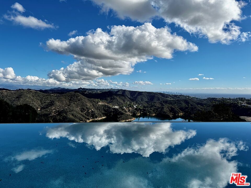2200 Stradella Road Los Angeles, CA 90077 - Photo 4 of 27 a view of a lake from a yard