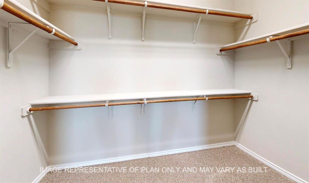 10720 Granada Drive Waco, TX 76708 - Photo 13 of 25 Walk in closet with light carpet
